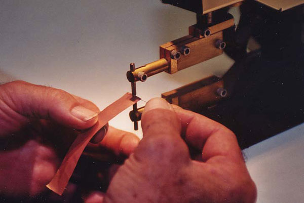 Spot welding a shield.